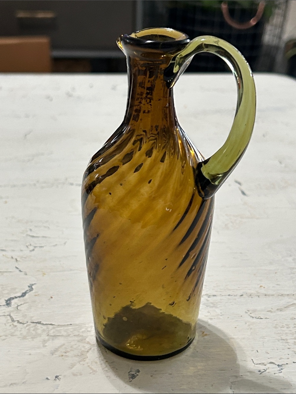 Amber Swirled Glass Pitcher with Green Handle